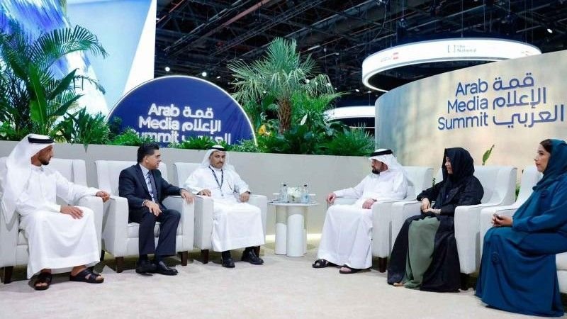 Senior media leaders and officials participate in a discussion panel at the Arab Media Summit 2026 in Dubai, seated on stage with Arab Media Summit branding in the background.