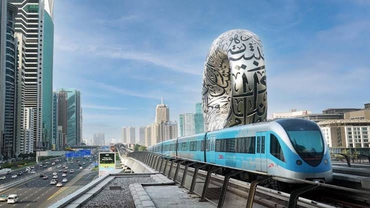Dubai Metro Blue Line train crossing museum of the future
