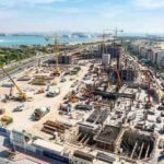 Construction progress at Marsa Al Saadiyat on Saadiyat Island, showing cranes, new residential buildings, nearby beaches, and Abu Dhabi's waterfront as the Dh100 billion development takes shape.
