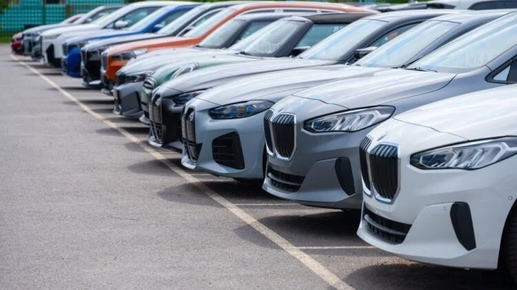 Row of parked cars at a UAE dealership, highlighting affordable and luxury vehicle options in the used car market.