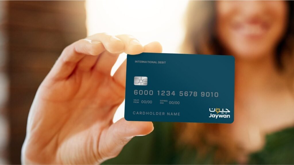 female hand holding Jaywan card