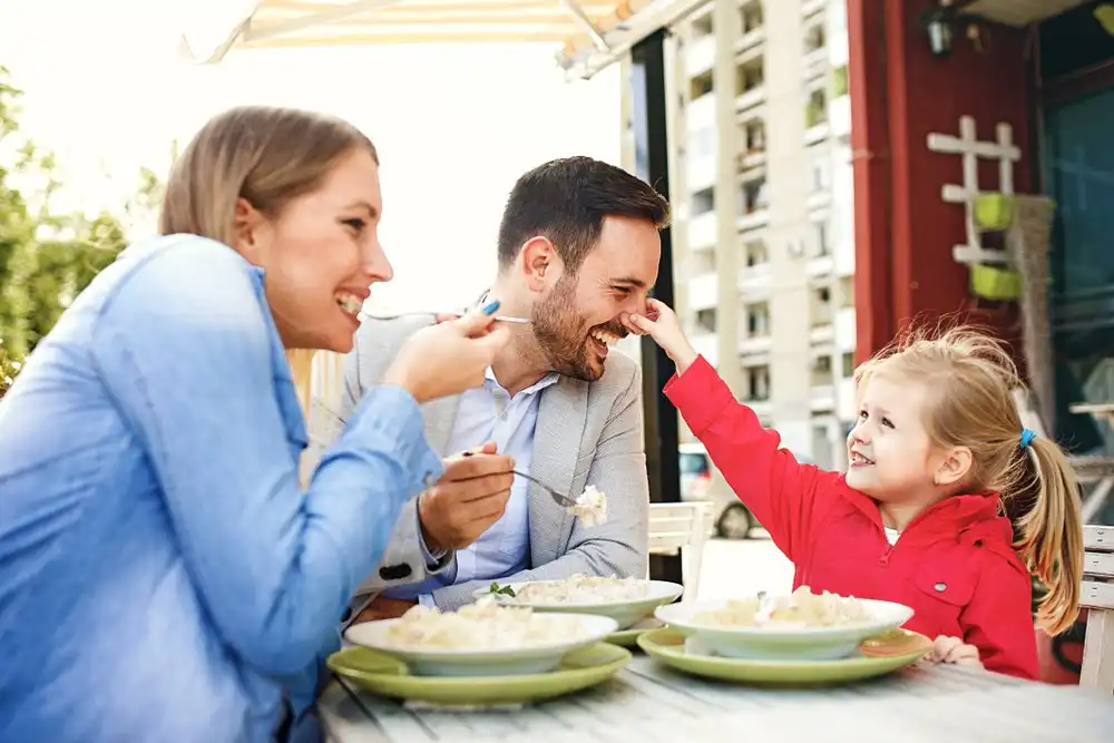 parents having lovely breakfast with their child