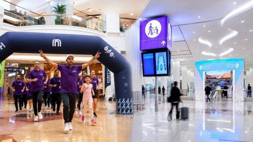Participants take part in the Dubai Mallathon inside an air conditioned shopping mall, using the indoor walking track as part of Dubai's summer fitness initiative.