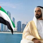 Sheikh Zayed bin Sultan Al Nahyan pictured against a modern UAE skyline with the national flag in the foreground, symbolizing the country's progress and the legacy of the 60th Accession Day.